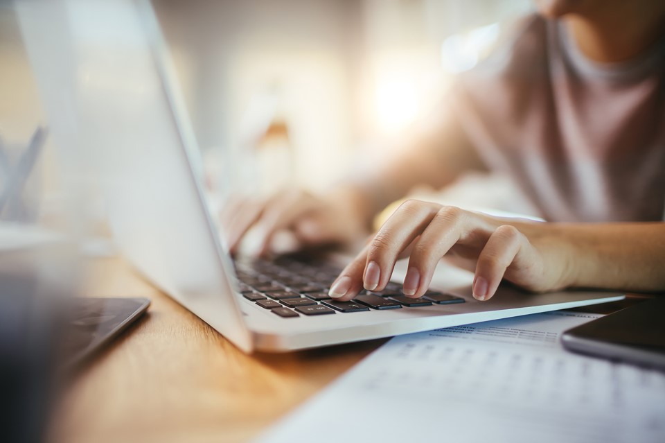 Woman typing on laptop