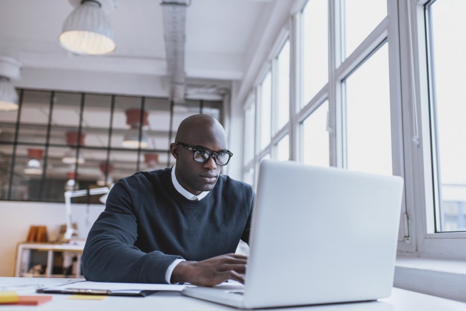 Black man on computer