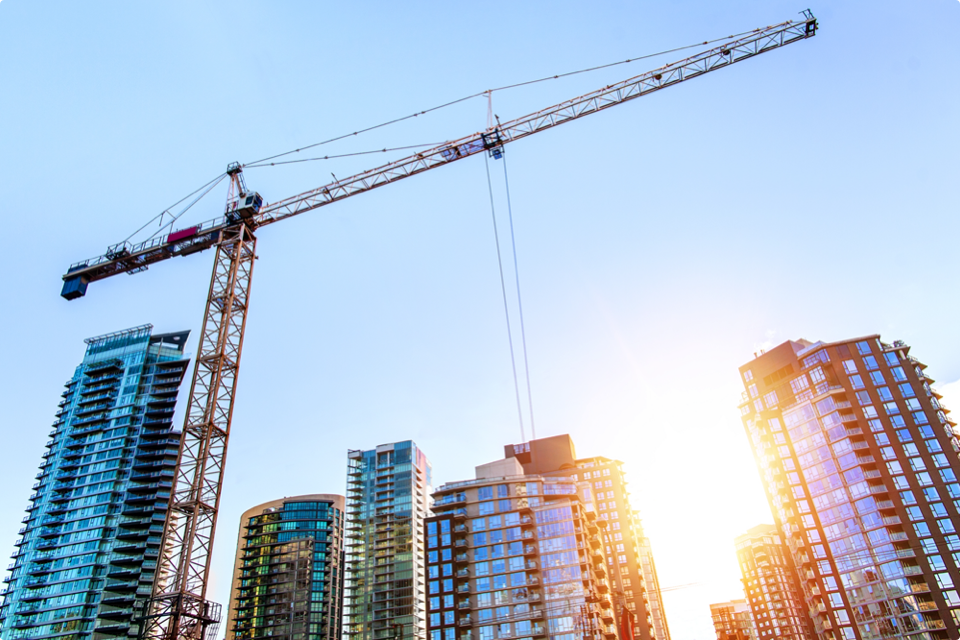 Construction crane with skyscrapers in the background